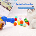 Pet toy set showing foam launch gun and assortment of soft plush balls for interactive fetch games