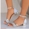 Women's plus size Roman-style sandal with rhinestone detail, buckle strap, and fish mouth toe opening.