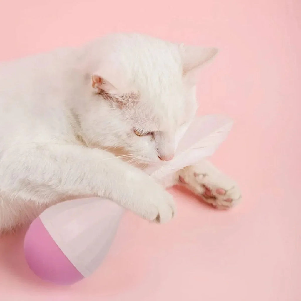 Green or pink feather tumbler cat toy with aluminium rod and self-healing ball component