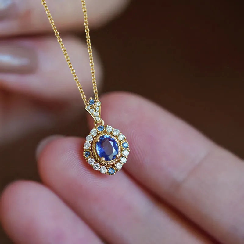Women's royal style necklace with mixed gem pendant on adjustable yellow gold chain