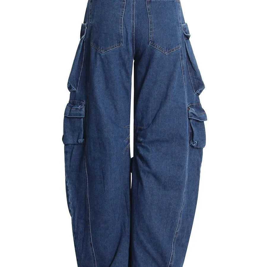 Dark blue wide-leg distressed jeans with high waist and multiple pockets on a mannequin