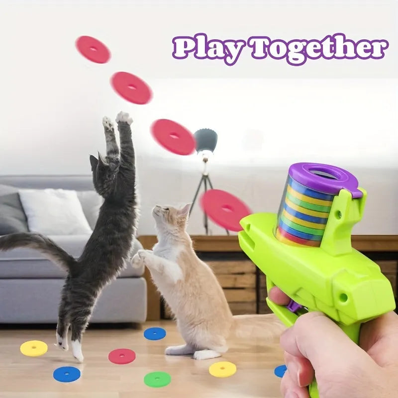 Green interactive cat toy launcher with foam discs for automatic launching play