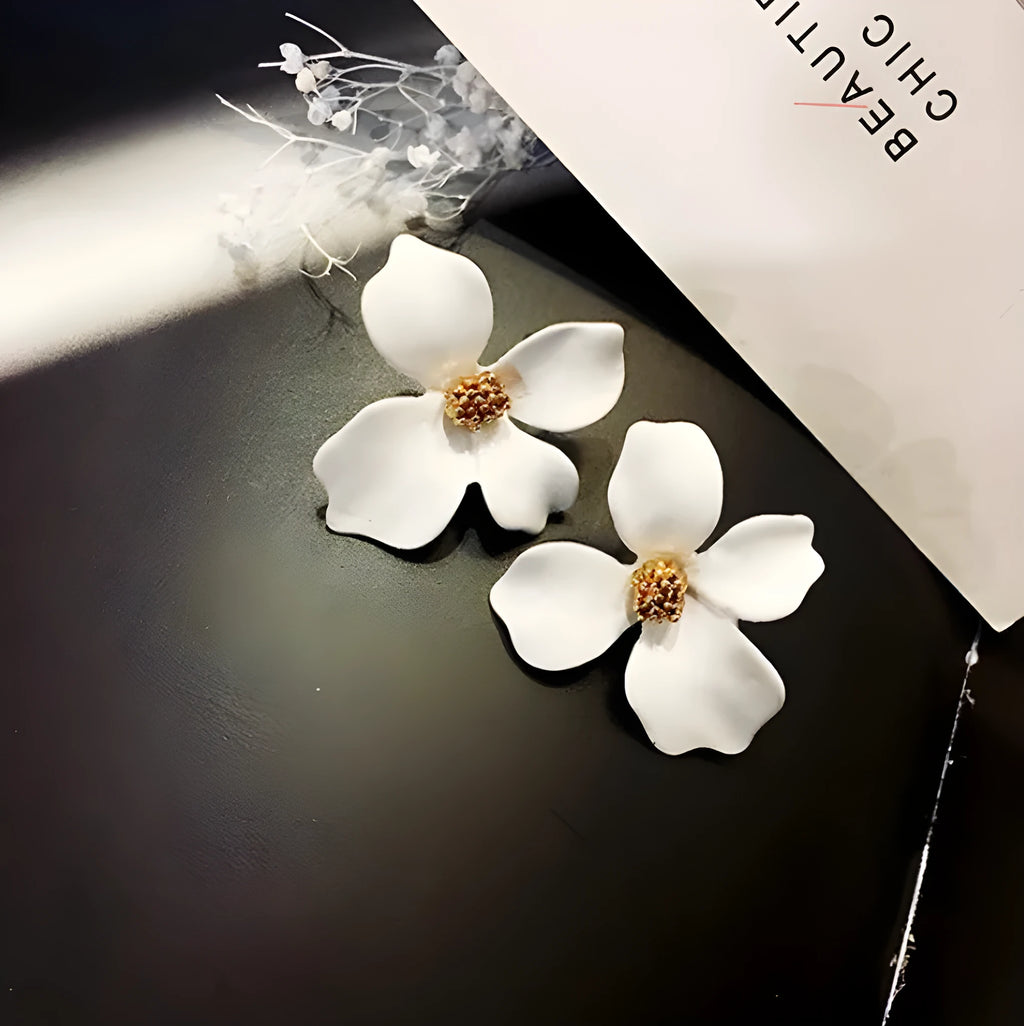 Flower shaped stud earrings in pink or white colour with electroplated alloy construction