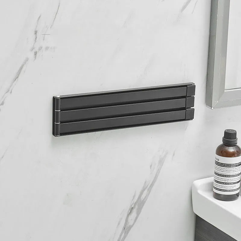 Black folding towel bar with adhesive installation for bathroom