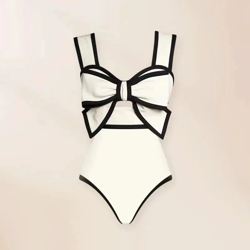 Women's black one-piece swimsuit with white round skirt and bow decoration for beach swimming