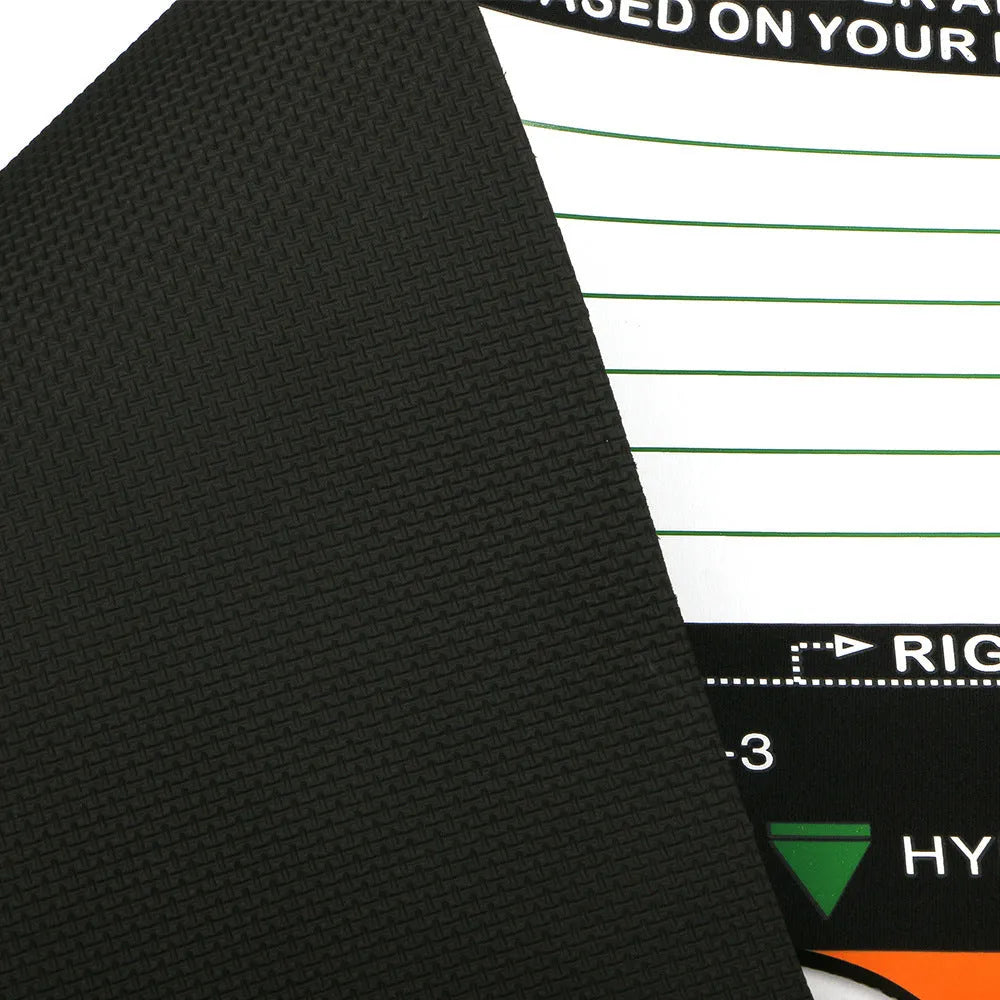 Black neoprene golf swing training mat with white alignment markings for stance correction.
