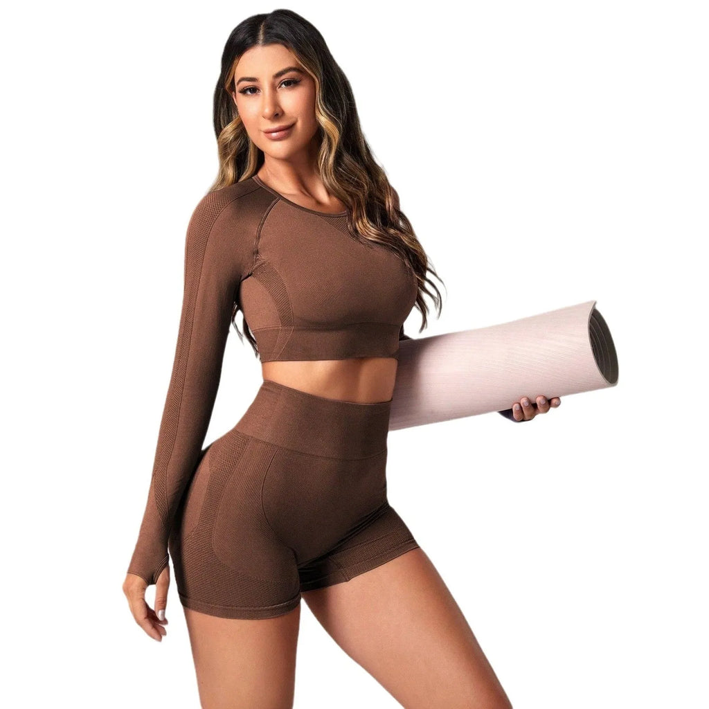 Women's black high waist yoga suit with long sleeves, consisting of matching top and pants