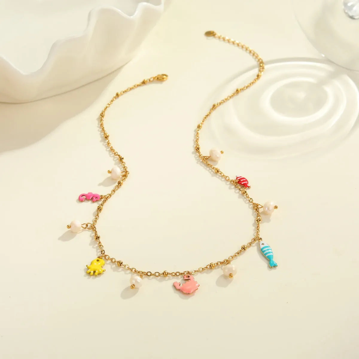 Stainless steel pendant necklace with geometric shape and 18K gold electroplating, paired with a titanium steel bracelet, for women