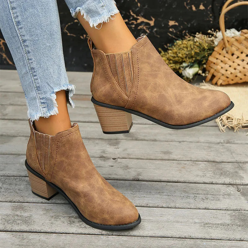 Women's black ankle boots with pointed toe and thick square heel design for autumn winter wear