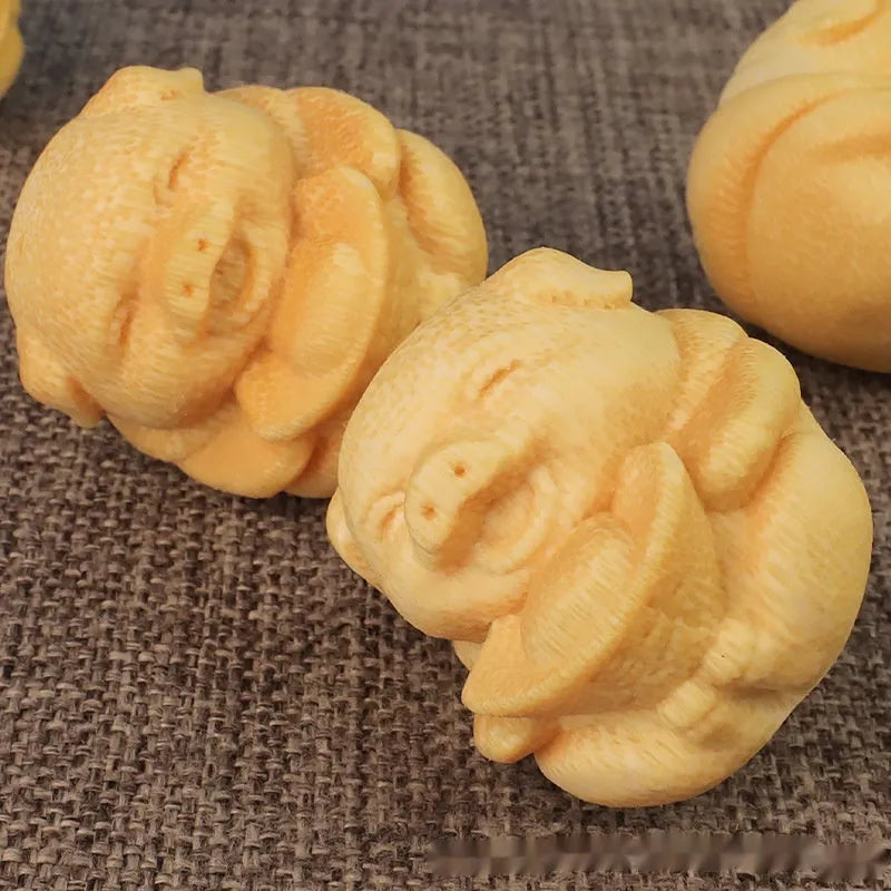 Solid bamboo pig carving ornament measuring 4cm tall with 3.5cm diameter