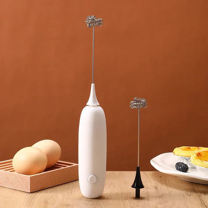 Black and white hand-held electric milk frother blender for coffee