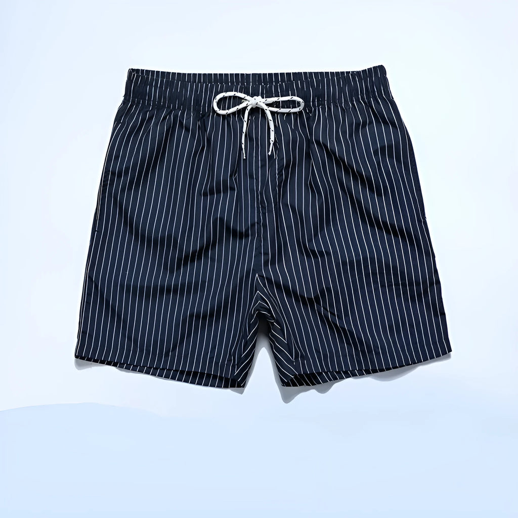 Man wearing grey striped polyester beach shorts with a straight leg opening