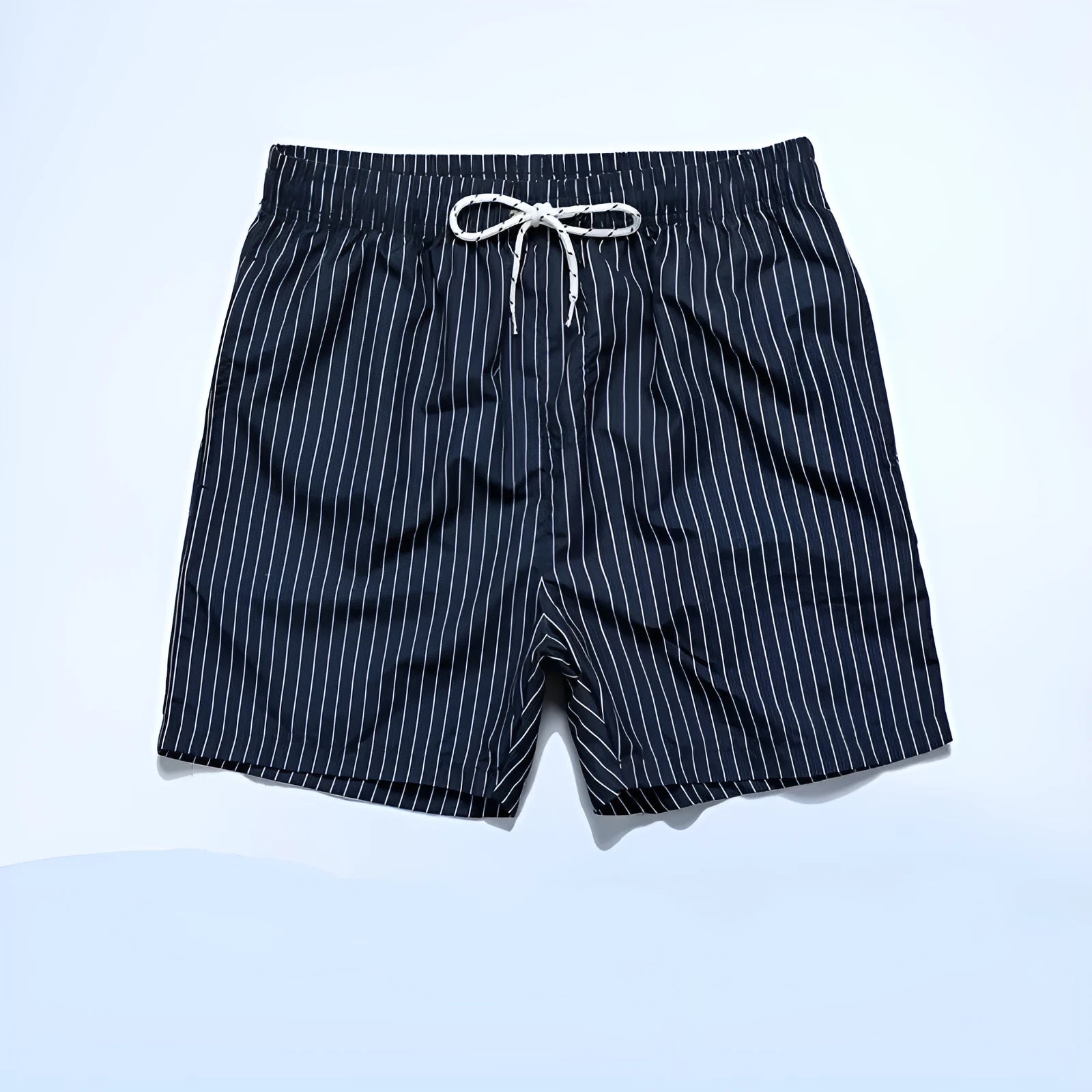 Man wearing grey striped polyester beach shorts with a straight leg opening