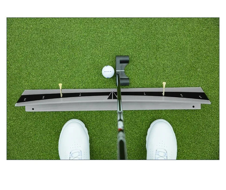 Adjustable golf putter trajectory balance simulator with PVC construction on a flat indoor surface.