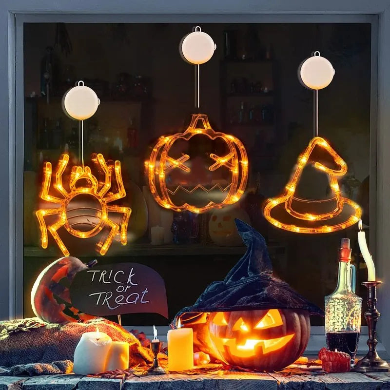 Seven Halloween themed battery-operated LED hanging lights with spider, pumpkin and ghost designs