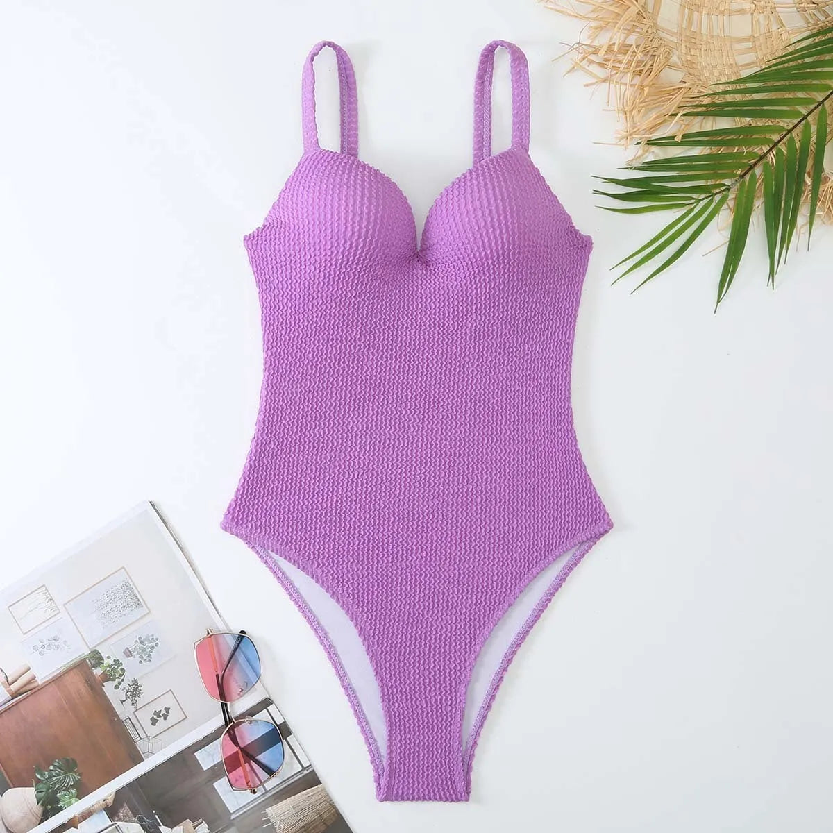 Women's sleeveless one-piece swimsuit with sunken stripe design in black, red, green, or purple