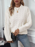 Women's beige loose pullover sweater with round neck and regular sleeves on hanger