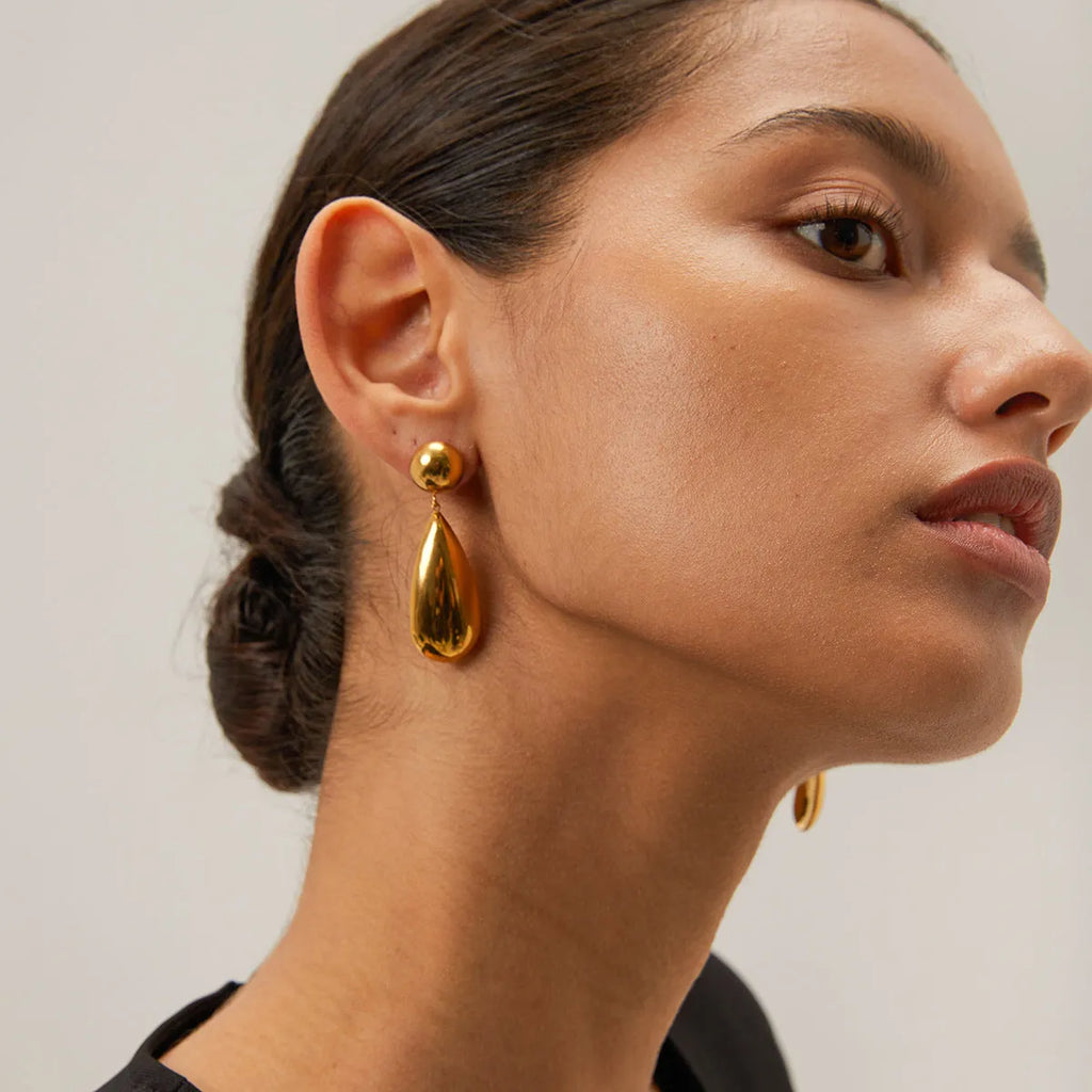 Gold electroplated stainless steel water drop pendant earrings with geometric hemisphere shapes
