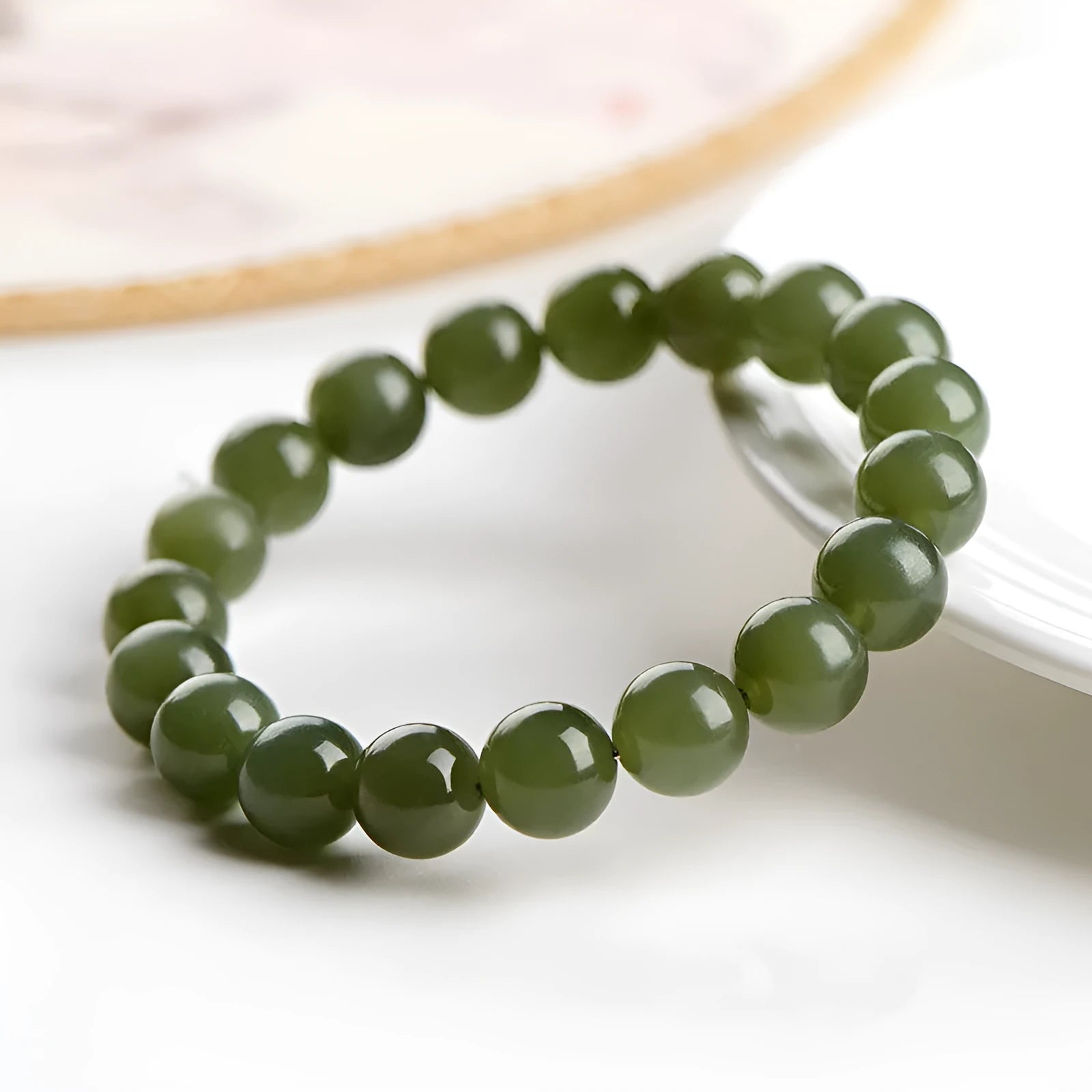 Hetian jade ball bracelet with spherical polished beads in clear colour tones