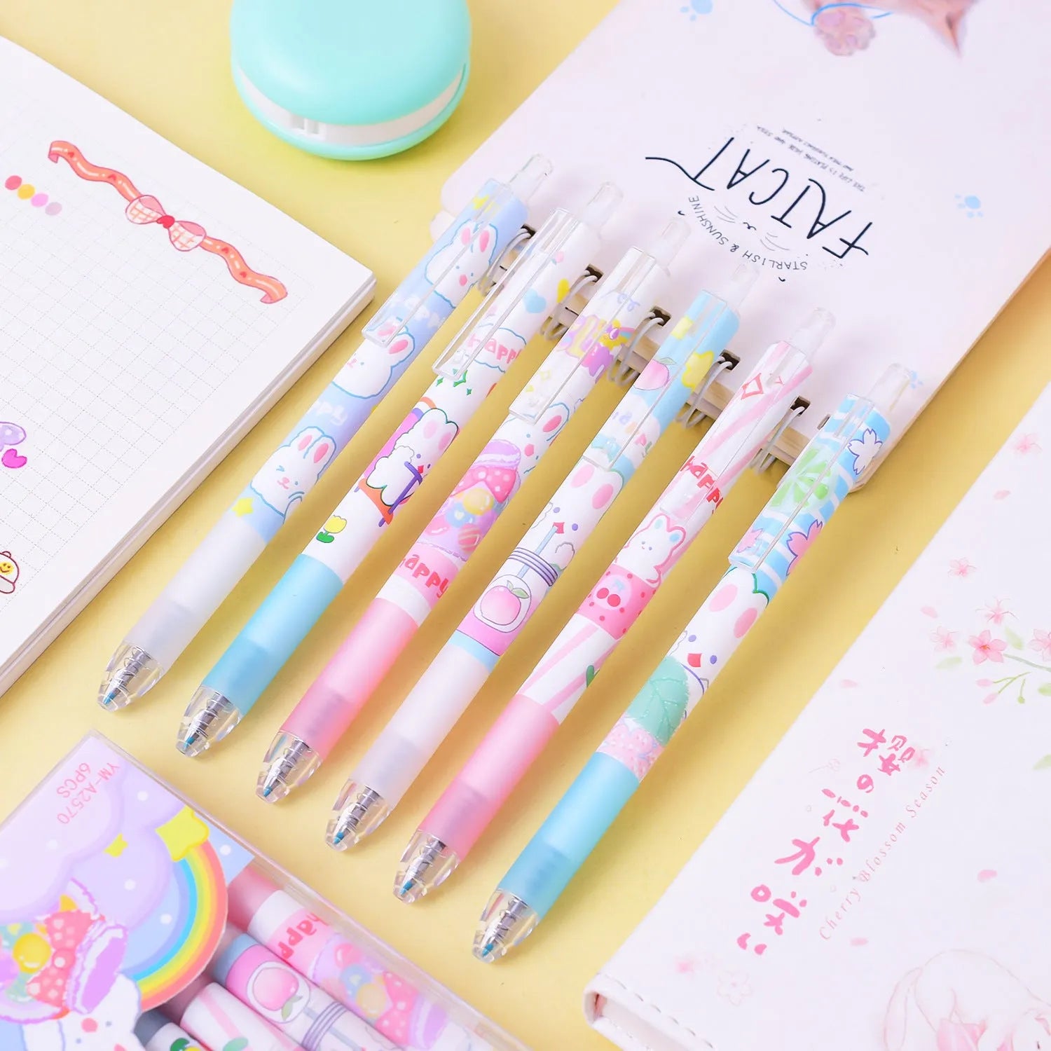 Six black ballpoint pens with cartoon bunny design and 0.5mm tips in packaging