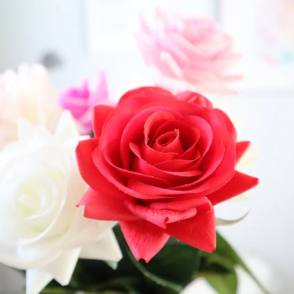 Artificial silk rose flower with red petals and green plastic stem measuring approximately 42cm long