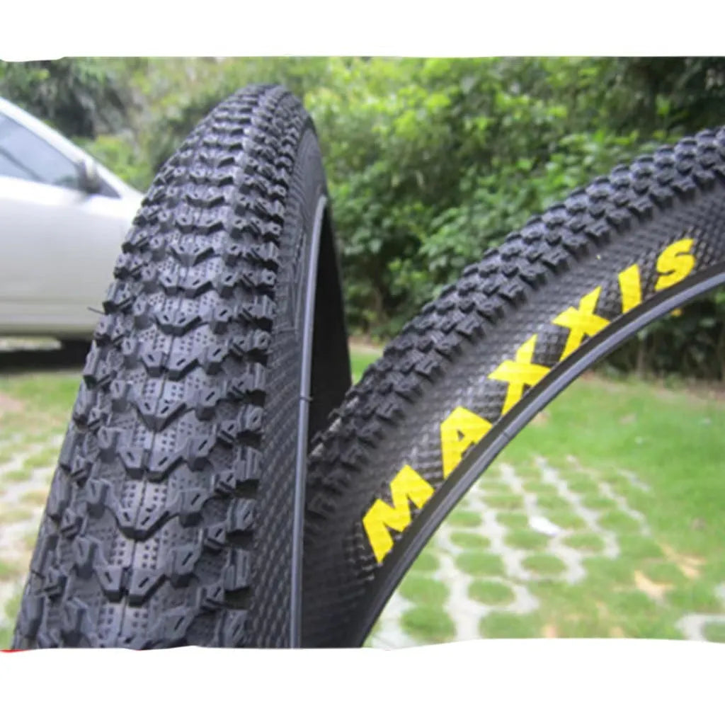Ultralight puncture-resistant mountain bike tyre shown in black with white label option, for 26, 27.5 and 29-inch wheels.
