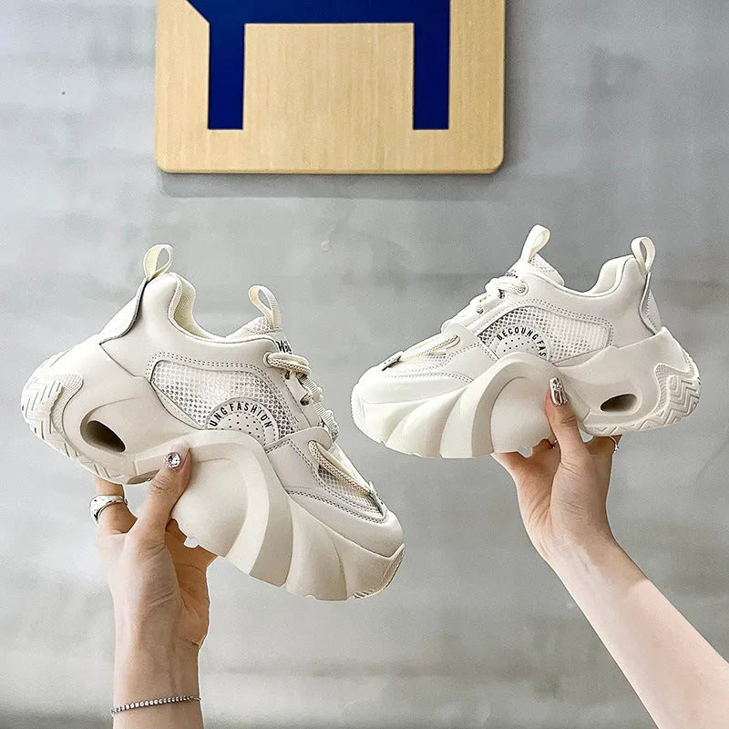 Women's beige platform sneakers with crossover ankle straps and a thick rubber sole.