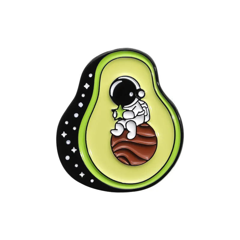 Colourful cartoon fruit design zinc alloy brooch pin on a fabric background.