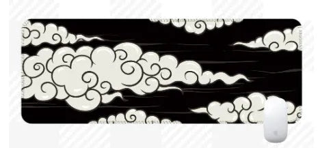 Large cloud pattern mouse pad with non-slip rubber base on a desk