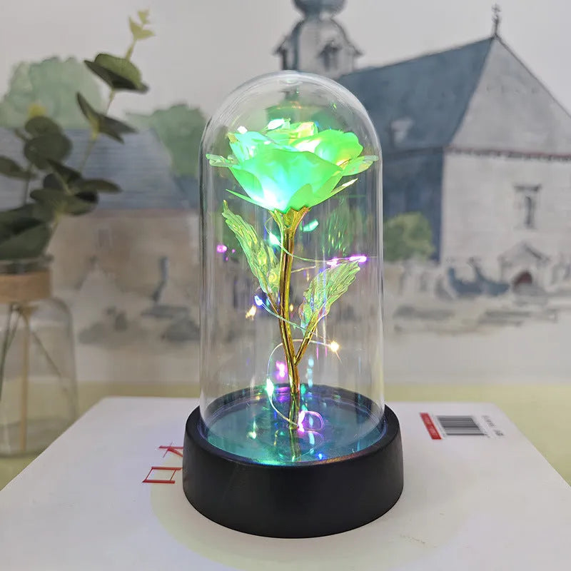 Glass cover small night lamp with plastic flowers in 15cm tall design with black base