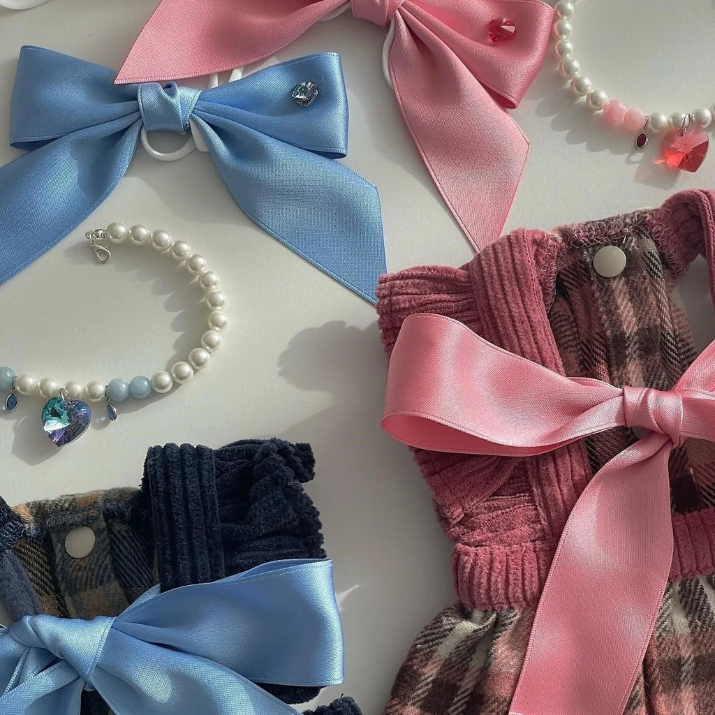 Adjustable pink princess bow hair band on a dog, made from double-sided polyester cotton ribbon.