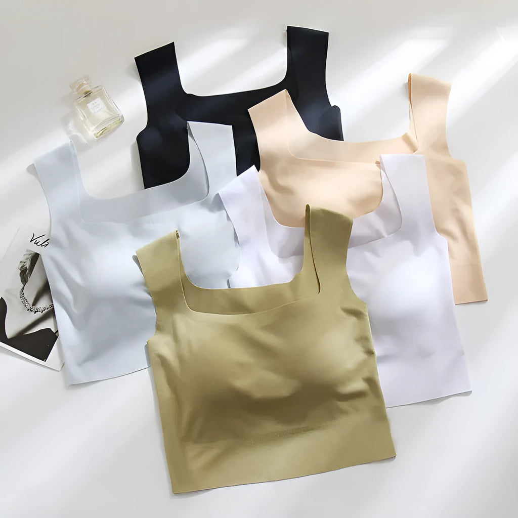 Seamless nylon sling vest for women with built-in thin full cup, shown in a light colour.