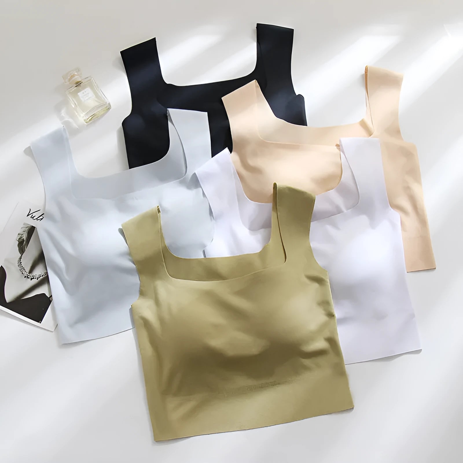 Seamless nylon sling vest for women with built-in thin full cup, shown in a light colour.