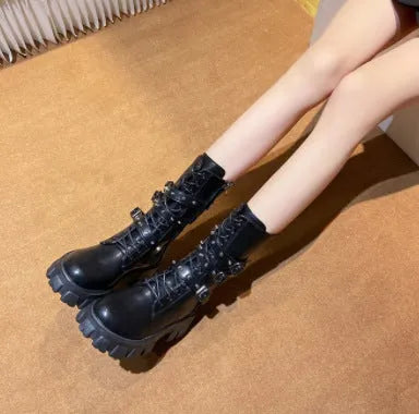 Women's black mid-calf knight boots with metal buckle and side zipper on a white background.