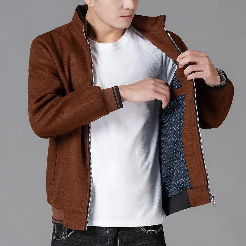 Men's grey sport-style fleece jacket with side pockets, shown on a hanger.