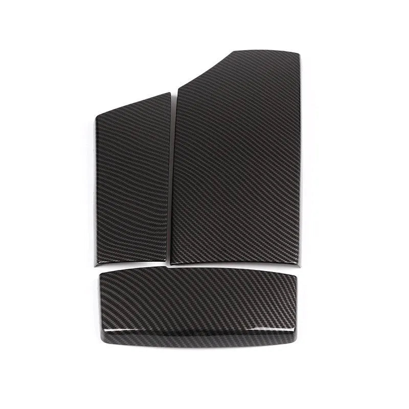 Set of three black ABS armrest box covers with a diagonal carbon fibre pattern and shiny finish.