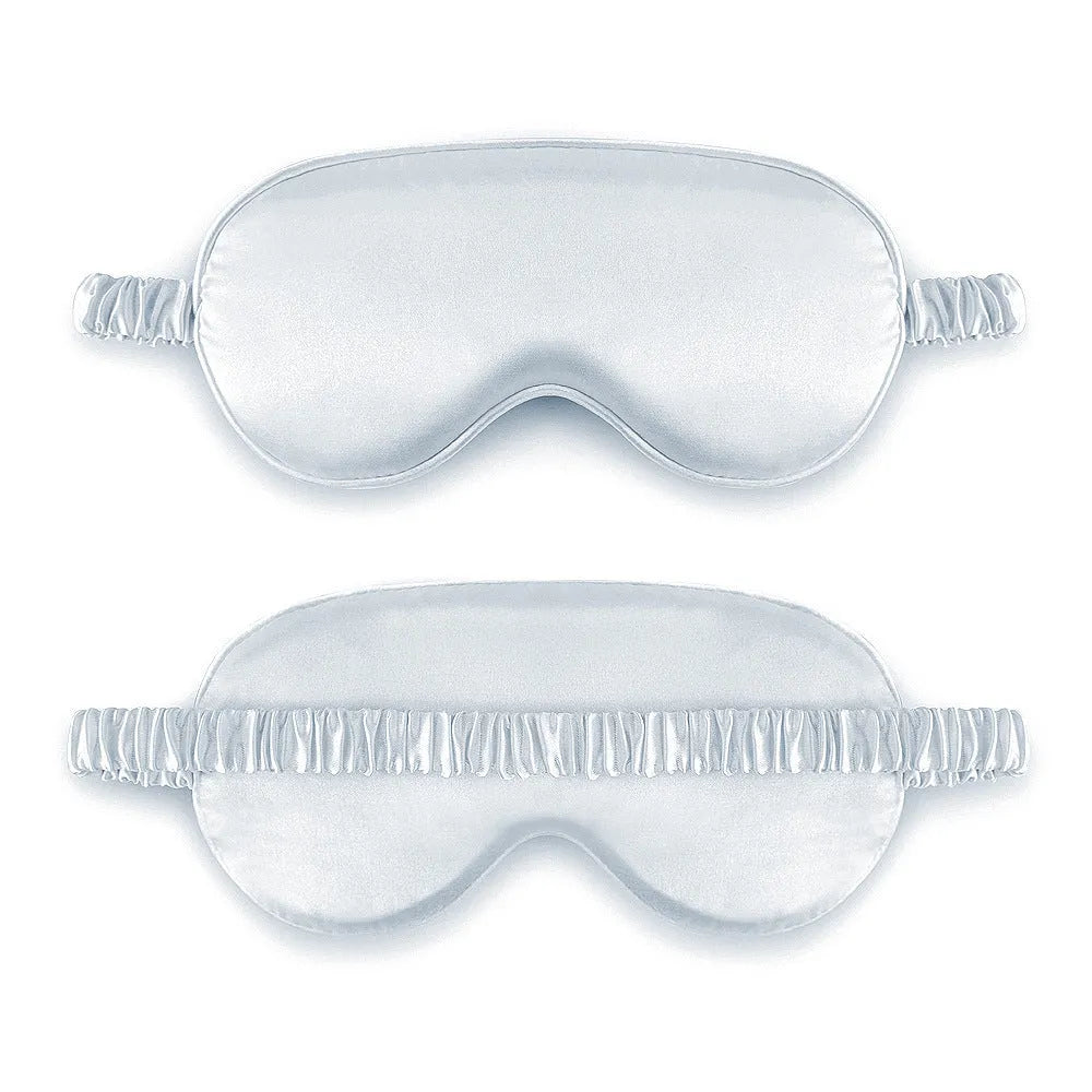 Double-sided silk-like sleep mask in rayon satin, shown in multiple colour options on a white background.