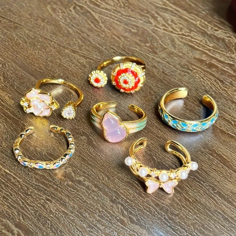 Adjustable copper ring with vintage gourd, floral, and bow design in New Chinese style, set with zircon stones.