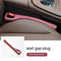 Polyurethane car seat gap filler strip in black colour, shown next to a vehicle centre console.