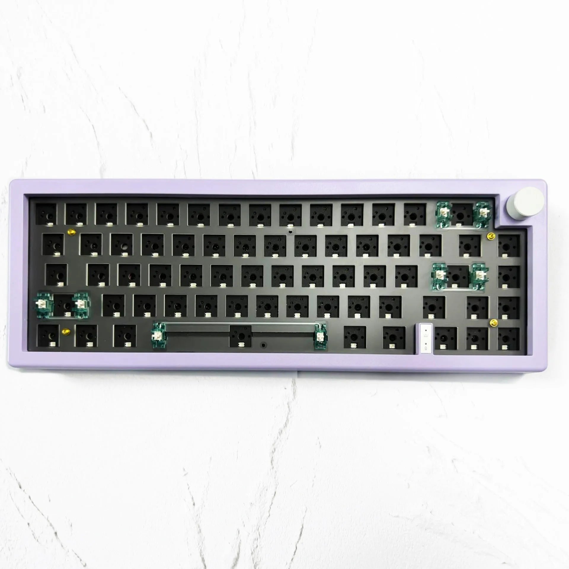 DIY mechanical keyboard kit components with RGB keys and knob on a black ABS case.