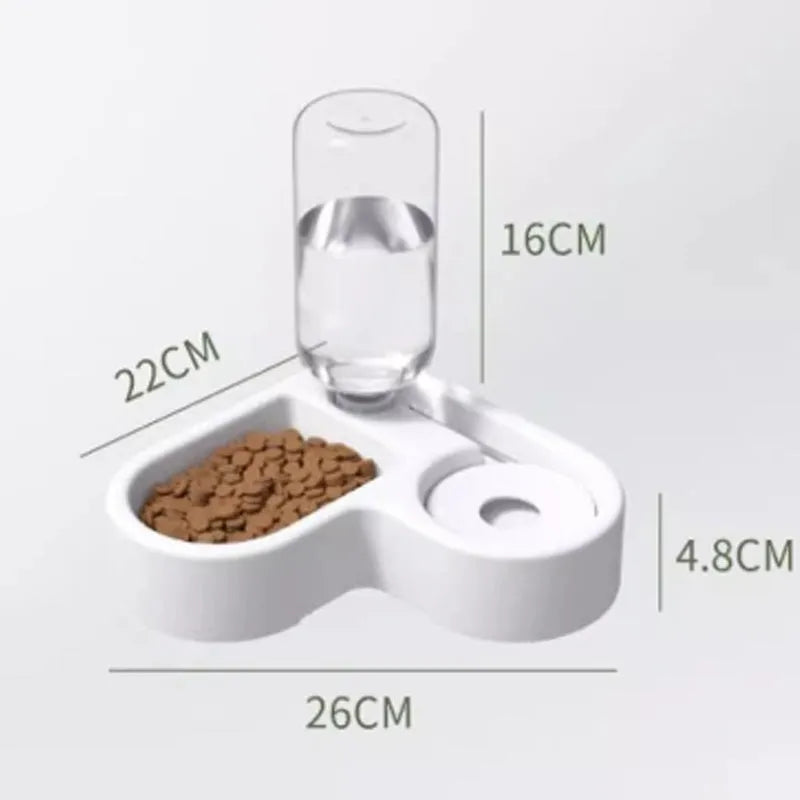 White plastic cat water fountain with filter on a floor next to a cat.
