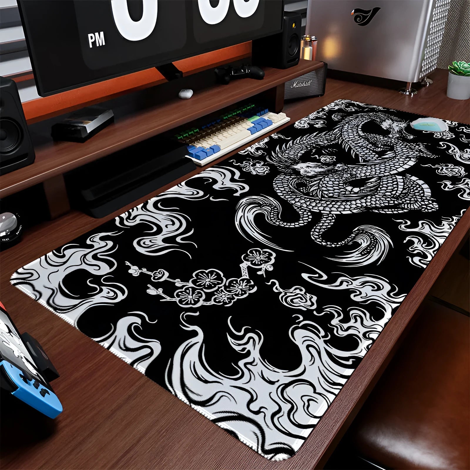 Cloth esports mouse pad with detailed floral dragon design on a desk, showing non-slip base.