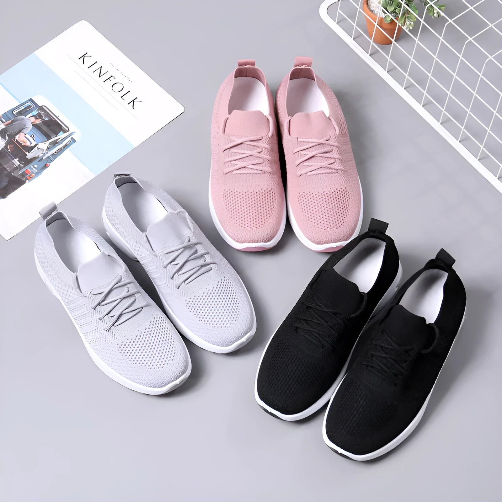 Women's casual mesh sneaker in black with lace-up front and round toe on a soft PVC sole.