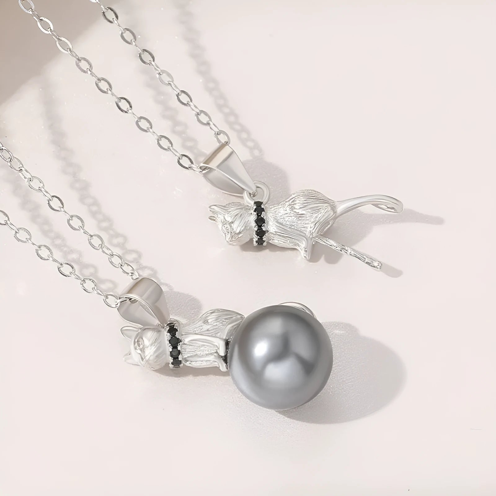 Sterling silver cat pendant necklace with electroplated finish on adjustable silver chain