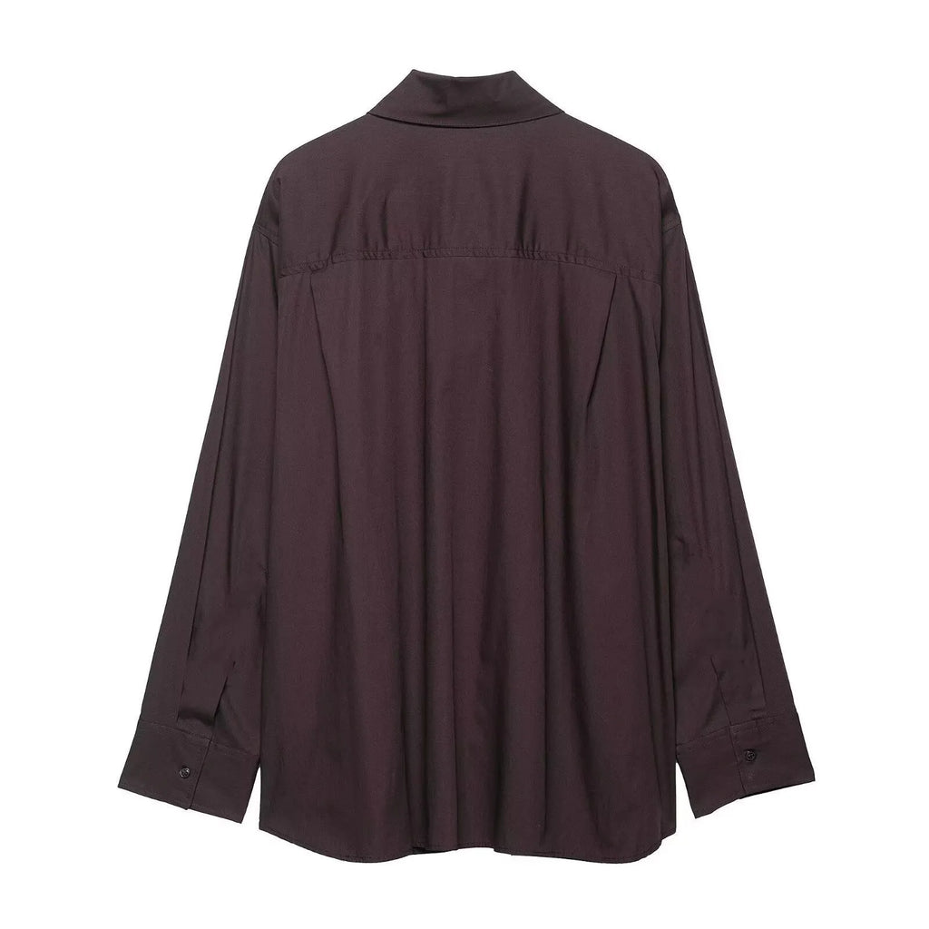 Brown women's loose fit poplin shirt with long sleeves and an integrated bow tie scarf at the neck.