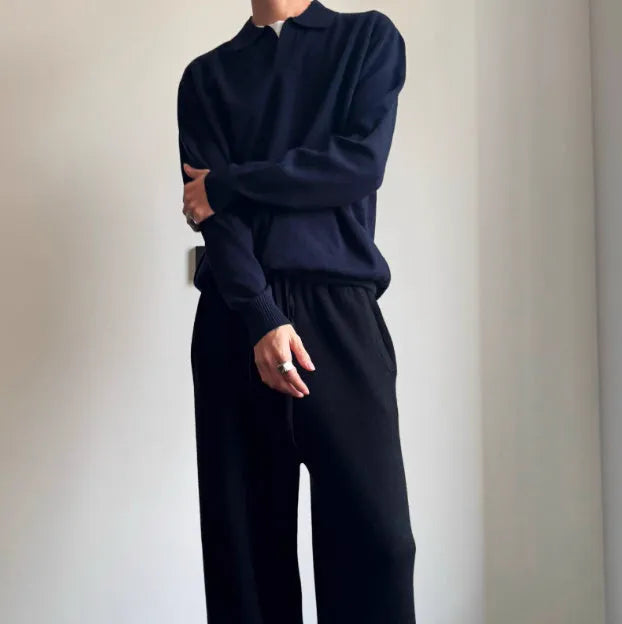 Man's milky white pure wool polo sweater with a lapel collar, shown in a loose fit.
