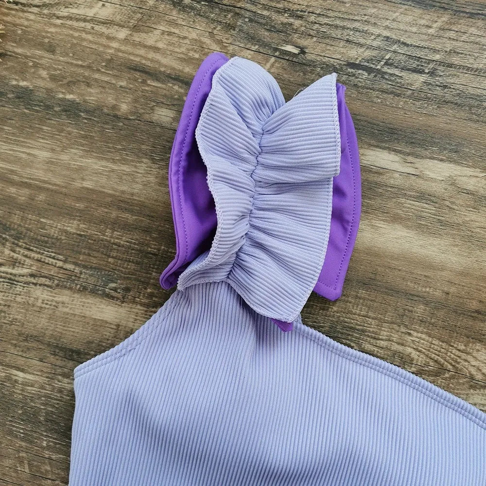 Women's single-shoulder tube top one-piece swimsuit with high waist in solid colour.