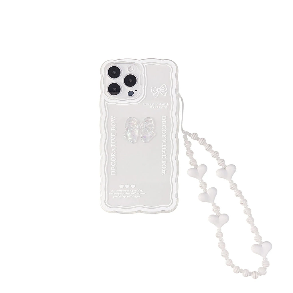 Transparent iPhone case with raised ice-through bow design and white love lanyard attachment