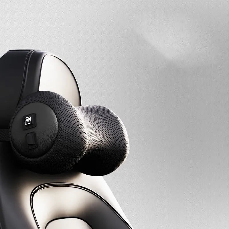 A black car massage cushion with electric vibration controls, placed on a car seat for neck and lumbar support.