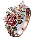 Colourful oil-drip finish butterfly personality ring with rose, insect, and leaf motifs on adjustable alloy band.